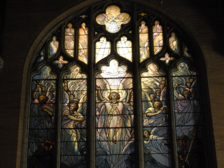 an ornate stained glass window in a church