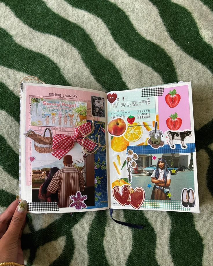 an open book with pictures of people and fruit on the pages, sitting on a zebra print blanket