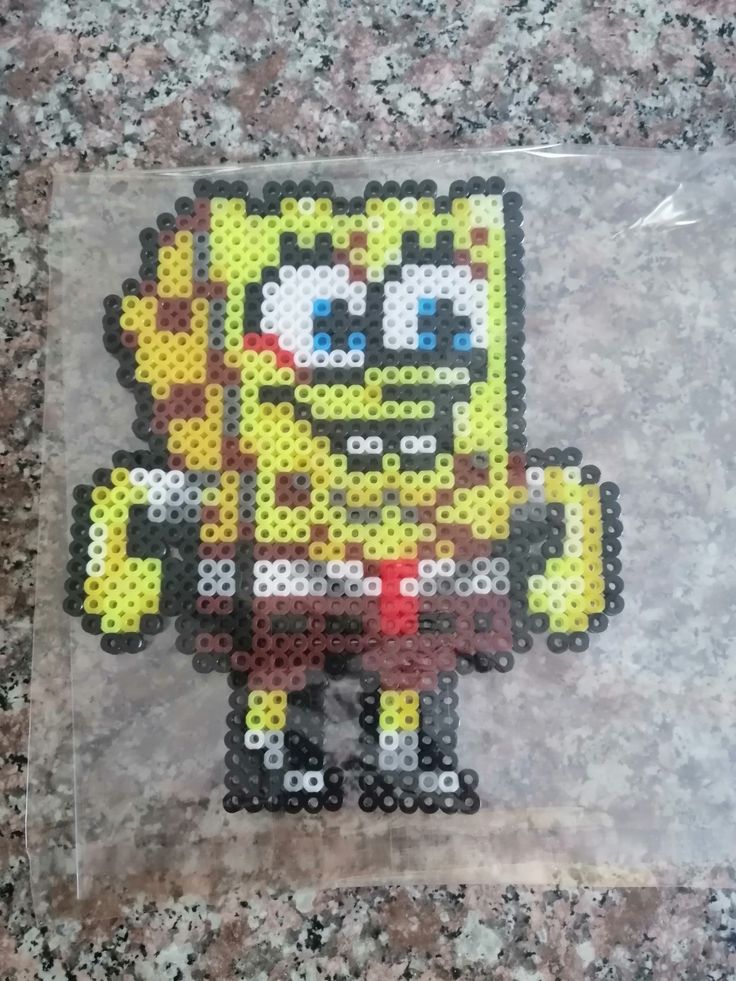 the simpsons character is made out of perler beads and has been placed in a plastic bag