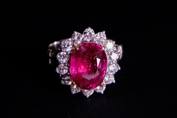 Fine halo ring set with a 4.03ct unheated ruby and accented with diamonds in 18k. The African ruby is red, saturated and fiery, showing a lovely spectrum of red in natural light. The ruby has natural inclusions, these inclusions display very organically in person, though in photos they may appear stark. The closed-back ruby ring is set in a Victorian style, from halo to shoulder, a refined look for a good sized natural ruby.  This ring is suitable for one after a large enough natural ruby with a Halo Ring Set, Red Ruby Ring, Rubin Ring, Halo Ring Setting, The Ring Face, Dresses Unique, Red Ruby, Wedding Dresses Unique, Halo Ring