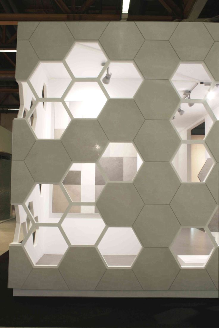 a room with hexagonal tiles on the wall