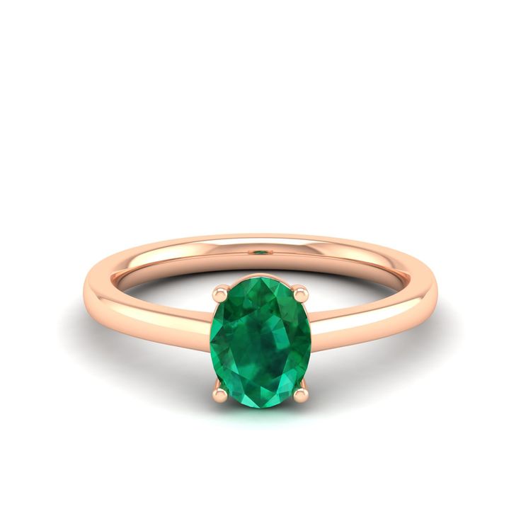 This elegant ring features a stunning oval emerald stone set in lustrous white gold. The vibrant green hue of the emerald is beautifully complemented by the brilliance of the white gold band, creating a timeless and sophisticated piece of jewelry. Metal: 14K Gold Setting Type: Prong Rhodium Finish: Yes, on White Gold Gemstone Details: Gemstone: Emerald Shape: Oval Average Dimensions: 8.00 x 6.00 MM Quantity: 01 Average Cut: Very Good Average Color: Medium to Dark Green Average Clarity: Eye Clean Oval Emerald Birthstone Ring In Fine Jewelry Style, Classic Oval Cabochon Emerald Ring, Fine Jewelry Emerald Green Oval Cabochon Ring, Green Oval Cabochon Emerald Ring, Classic Oval Tsavorite Emerald Ring, Classic Green Emerald Oval Cabochon Ring, Classic Green Oval Cabochon Emerald Ring, Timeless Oval Emerald Promise Ring, Classic Oval Tsavorite Ring