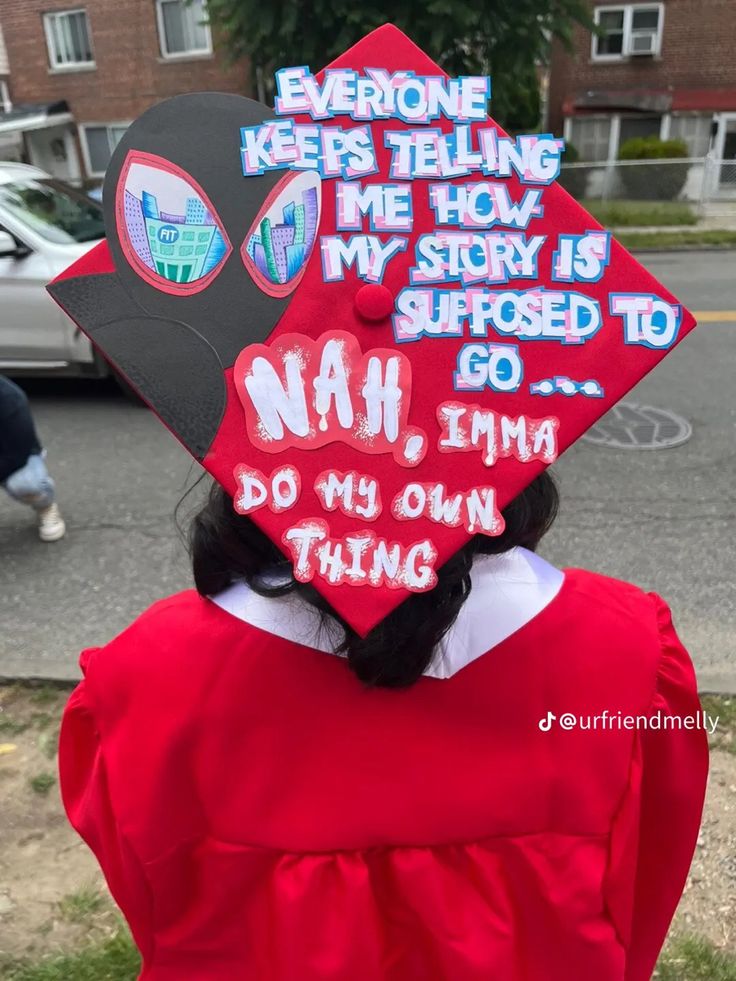 a woman wearing a red graduation cap with writing on it's back and the words, everyone keeps telling me how my story is supposed to go