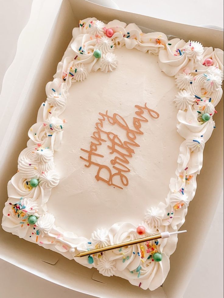 a birthday cake in a box with writing on it