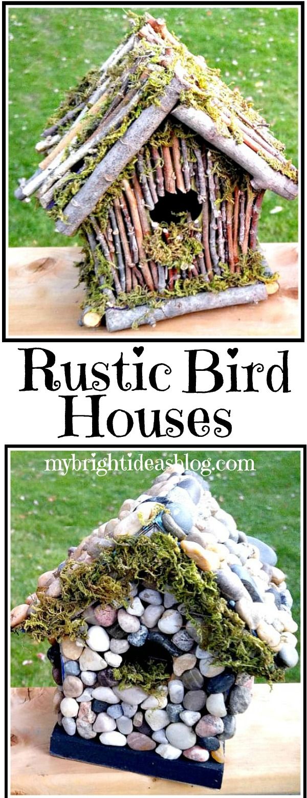 a bird house made out of sticks and rocks with moss growing on it's roof