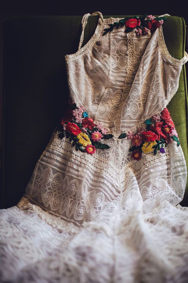 a white dress sitting on top of a green chair