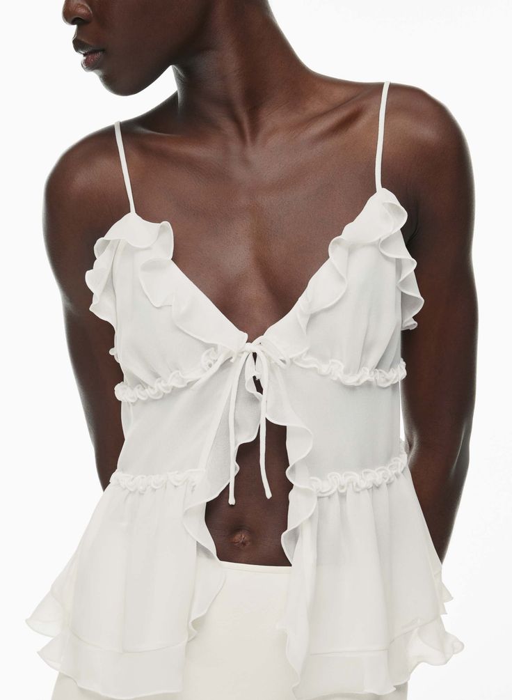 AMORE CAMISOLE V-neck Ruffled Camisole For Vacation, Feminine V-neck Ruffled Camisole, Beach Camisole With Ruffles, Feminine Ruffled Camisole, Chic Flowy Beach Camisole, Chic Flowy Camisole For Beach, Flowy Chic Camisole For Vacation, Feminine Camisole With Adjustable Ruffled Straps, Spring Camisole With Ruffled Tie Straps