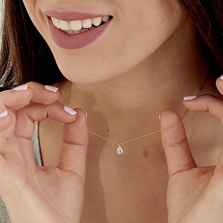 The Delicate CZ Drop Necklace features a high-quality cubic zirconia pendant in a teardrop format on a delicate 14K gold-filled chain. This tiny diamond pendant necklace is perfect for a bridesmaid necklace gift or for that special occasion. PRODUCT DETAILS: The stone is 6mm. Zirconia Stone in a 14k goldfilled setting MATERIALS: 14K Gold Filled 14K Gold Filled jewelry is not the same as gold-plated jewelry. It contains 5% of solid gold and is done by a process of heat bonding. The layer of gold Diamond Teardrop Pendant Drop Necklace Gift, Diamond Teardrop Pendant Necklace For Gift, Fine Jewelry Teardrop Solitaire Necklace Gift, Teardrop Drop Necklace With Diamond Cut For Gift, Delicate Teardrop Diamond Necklace, Dainty Diamond Teardrop Pendant Necklace For Wedding, Delicate Diamond Drop Necklace Gift, Diamond Drop Necklace With Delicate Chain For Gift, Diamond White Teardrop Pendant Solitaire Necklace As Gift