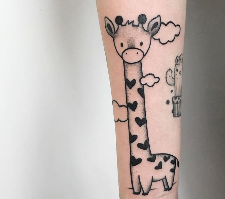 a giraffe with hearts on it's arm