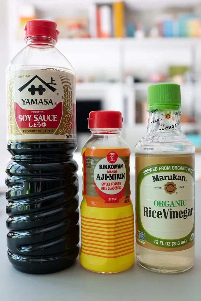 three different types of condiments sitting on a counter top next to each other