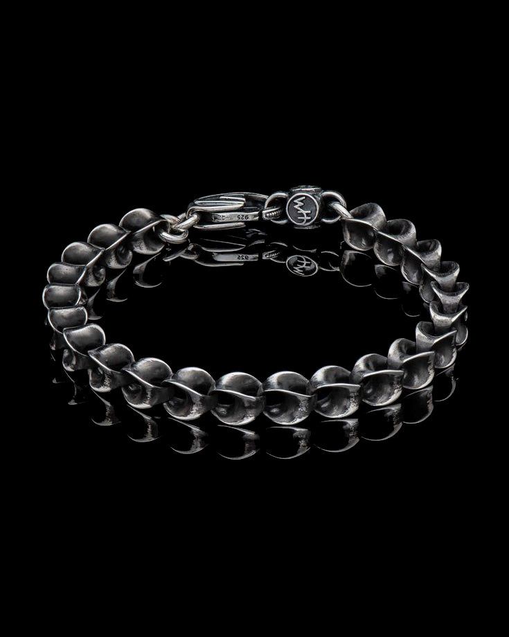 This bracelet features a unique link design, crafted in sterling silver and finished with a... Modern Hand Forged Metal Bracelet, Elegant Gunmetal Link Jewelry, Elegant Stainless Steel Chain Bracelet In Gunmetal, Modern Gunmetal Chain Link Jewelry, Sterling Silver Box Chain Bracelet With Oval Links, Modern Gunmetal Chain Bracelet With Solid Link Construction, Elegant Gunmetal Metal Bracelets, Modern Gunmetal Bracelets For Formal Occasions, Elegant Gunmetal Metal Bracelet