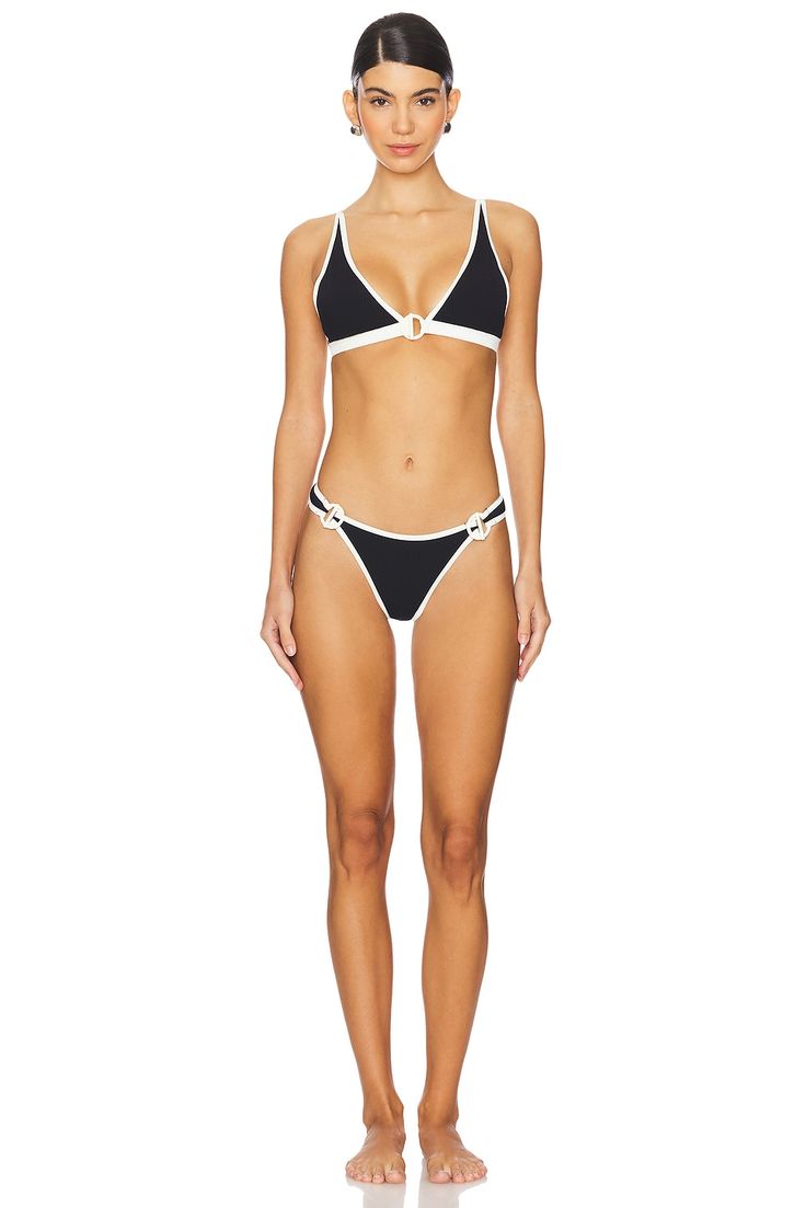 California-based designer Monica Wise delivers a collection of stylish swimwear that brings a state of opulence to any poolside get-together. Pieces are fashion forward, offering modern designs in luxurious materials that are sophisticated, but also beach appropriate.92% nylon 8% spandex.  Made in China.  Hand wash.  Front circle-clasp closure.  Adjustable shoulder straps.  Removable padded cups.  Ribbed fabric, Item not sold as a set.  .  .  .  .  .  .  .  .  . Chic Triangle Top Swimwear For Beach, Chic Triangle Top Swimwear For Beach Season, Chic Swimwear For Resort Season Poolside, Chic Swimwear For Poolside Resort Season, Chic Resort Season Swimwear For Pool, Chic Triangle Top Swimwear For Swimming, Resort Season Triangle Top Swimwear For Sunbathing, Chic Tie-side Bottom Swimwear For Pool, Chic Tie-side Swimwear For Pool