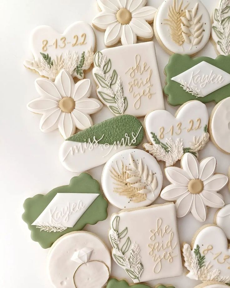 some cookies are decorated with flowers and leaves