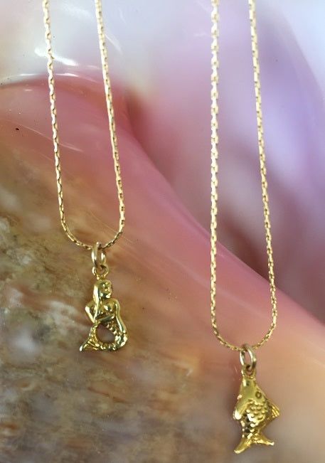 Ocean Inspired 14kt Gold filled Necklaces - Sterling platted gold charms (Mermaid & Fishie). These feminine and delicate 15" Necklaces were made to remind us of the ocean's beauties. They can be worn by themselves, or can be layered with other like Necklaces. Each are sold separately for $58/each. Buy yours today! Ocean-inspired 14k Gold Jewelry, Gold Ocean-inspired Charm Necklaces As Gift, Gold Ocean-inspired Charm Necklace For Gift, Ocean-inspired Gold Charm Necklace For Gift, Gold Charms, Ocean Inspired, Jewelry Lookbook, Buy Buy, Evil Eye Jewelry