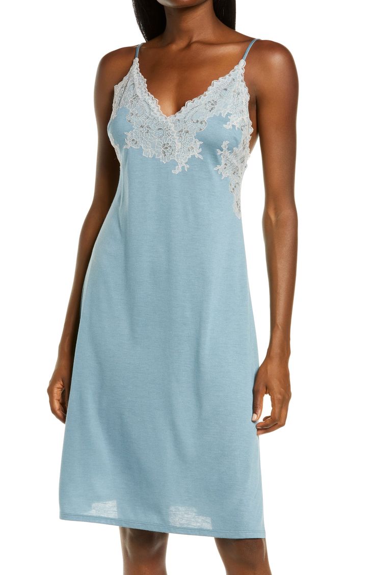 The exquisite fabrication of a blissfully soft modal blend, along with delicate lace, upgrades this essential nightgown to an indulgence. 32" length (size Extra Small) V-neck Adjustable straps Side slits 65% modal, 35% polyester Machine wash, tumble dry Imported Lingerie Elegant V-neck Sleepwear For Relaxation, Lace Sleepwear With Delicate Straps And V-neck, V-neck Slip Dress With Delicate Lace For Daywear, Sleeveless Delicate Lace Nightgown For Loungewear, Sleeveless Nightgown With Delicate Lace For Loungewear, Delicate Lace Sleeveless Dress For Loungewear, V-neck Sleepwear With Delicate Straps, Elegant Camisole With Built-in Bra For Bedtime, Elegant Bedtime Slip With Spaghetti Straps