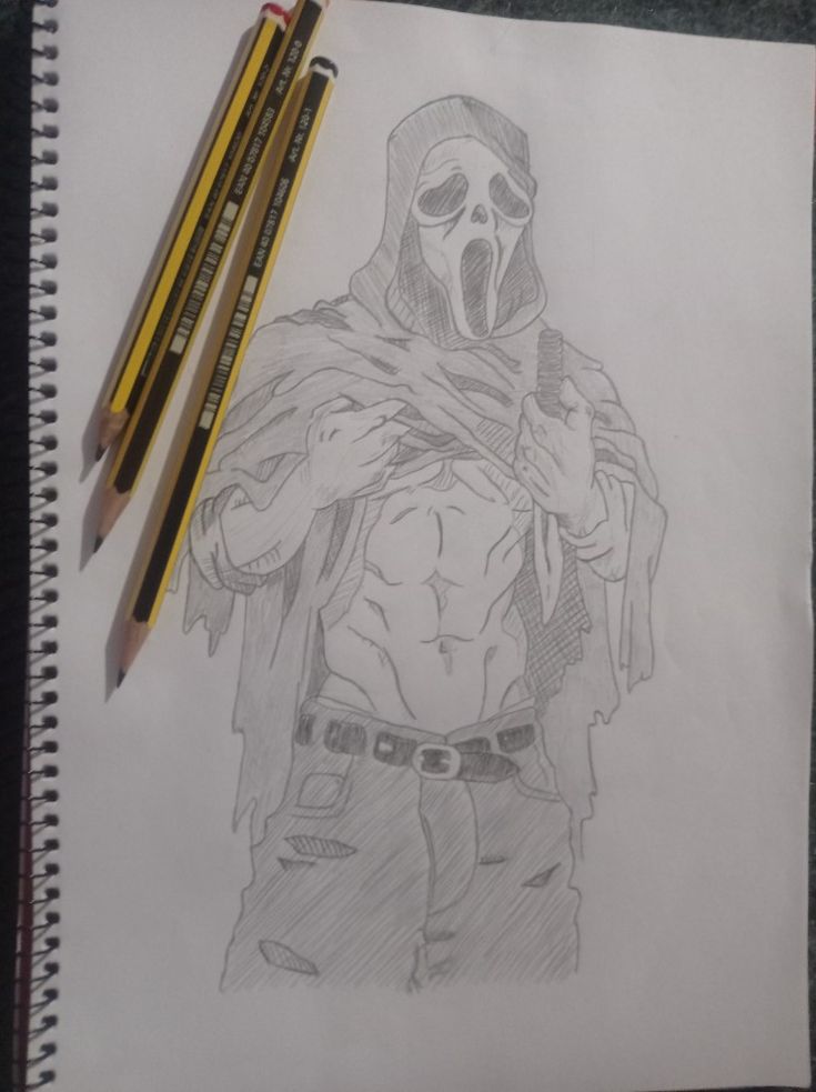 a drawing of a man with a hoodie and two pencils next to it