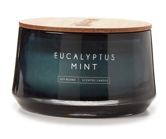 a black candle with a wooden lid and the words eucalyptusplus mint on it