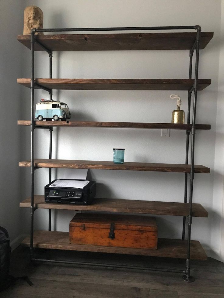 a book shelf with some books on top of it and a toy truck next to it