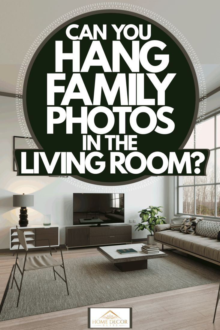 a living room with the words can you hang family photos in the living room?