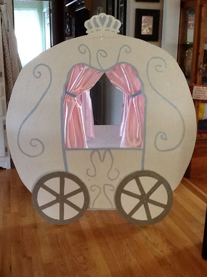 an inflatable horse drawn carriage with pink curtains