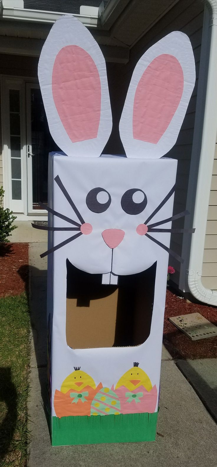 a cardboard box with an image of a bunny on it's face and ears