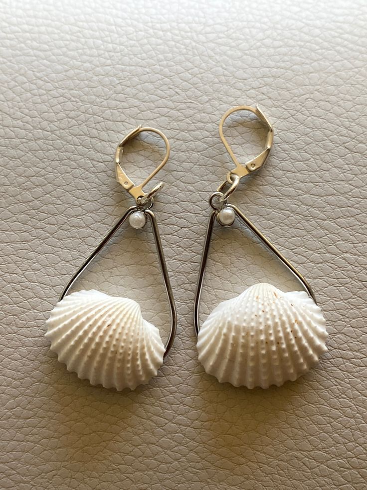 Beautiful Cocoa Beach shell and pearl earrings  made with hand collected shells from the world famous Cocoa Beach, Florida! Elegant Nickel-free Beach Earrings, Elegant Nickel-free Earrings For The Beach, Handmade Pearl Shell-shaped Shell, Handmade Shell Earrings For Summer, Beachy Shell Dangle Earrings, Pearl Drop Shell-shaped Earrings In Mother Of Pearl, Shell Dangle Earrings For Beach, Beach Shell Dangle Earrings, Shell Drop Earrings For The Beach