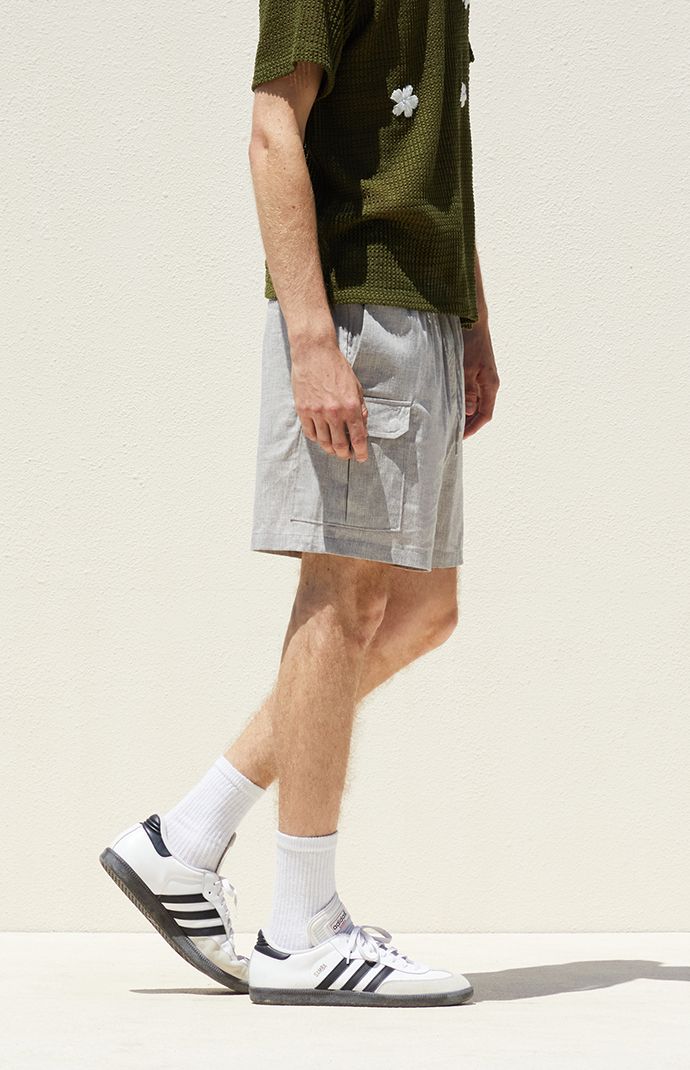 Elevate your summer style with PacSun's Linen Cargo Shorts, designed for both comfort and functionality. Crafted from a lightweight linen blend fabrication, these shorts feature a drawstring waistline and side pockets for convenience. With cargo pockets adding a touch of utility, and a standard fit ensuring a comfortable wear, they're the perfect choice for all your warm-weather adventures.


	 Elastic stretch waistline
	Side pockets
	Cargo pockets
	Standard fit
	6.5/8" Inseam
	17" Outseam
	11.5" Front rise
	73% Cotton, 25% linen, 2% spandex
	Machine washable
	Model is wearing size medium
	Model Measurements: 6'1.5” Height, 28” Waist, 32” Inseam Cargo Shorts Men, Exclusive Collection, Tee Shop, Model Measurements, Pacsun, Summer Style, Cargo Shorts, Warm Weather, Linen Blend