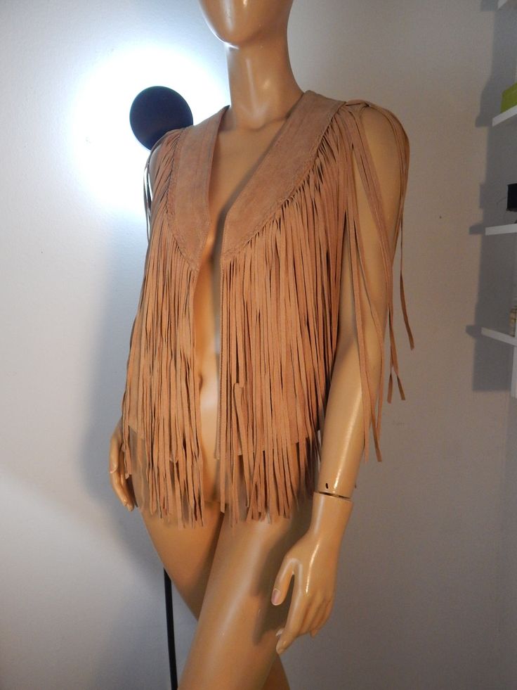 suede fringe vest with bust appx 40 vest length 30 fringe length 20 tons of fringe braiding around lapel really nice quality with label removed looks new but is totally western and rustic Sleeveless Western Outerwear For Fall, Fitted Western Vest For Spring, Western Style Fitted Vest For Spring, Spring Fitted Western Vest, Fitted Sleeveless Vest With Fringe, Fall Festival Vest With Fringe, Festival Fringe Brown Vest, Brown Fringe Vest For Festival, Fitted Fringe Vest For Festivals