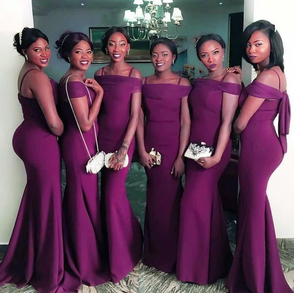 the bridesmaids are all wearing purple dresses and one is holding her hand on her hip