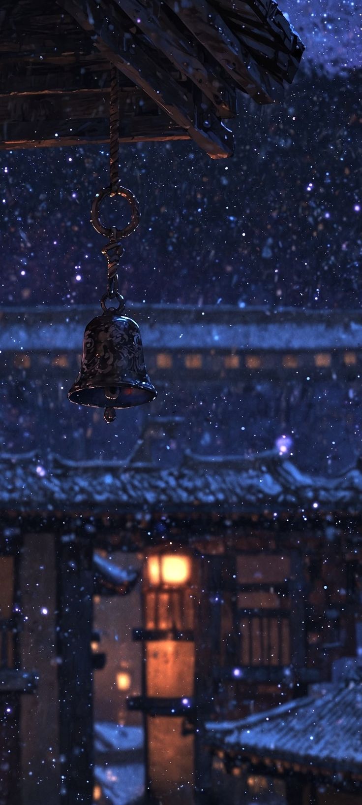 a bell hanging from the roof of a building with snow falling on it and buildings in the background