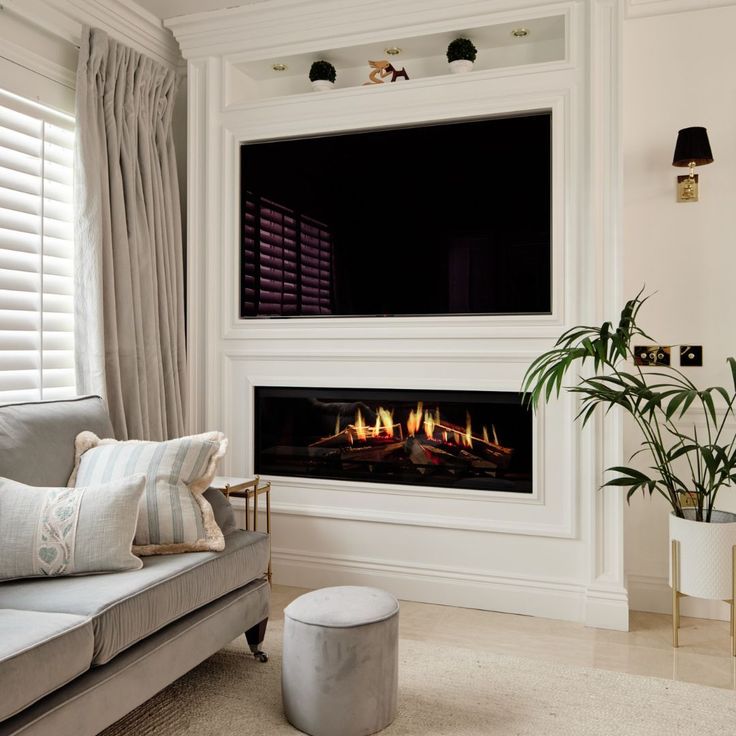 a living room with a couch and fireplace