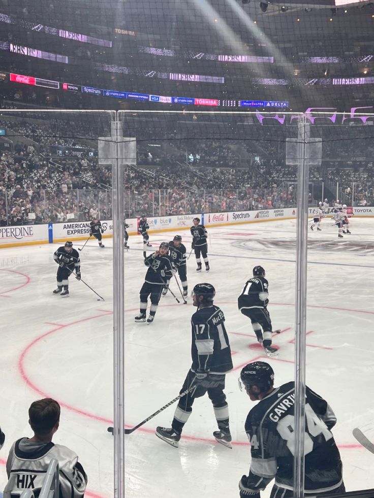 the hockey players are playing on the ice