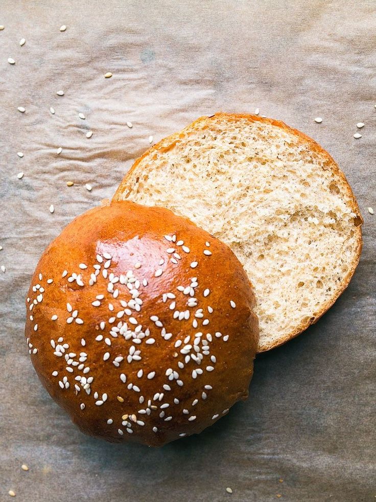 two loaves of bread with sesame seeds on top