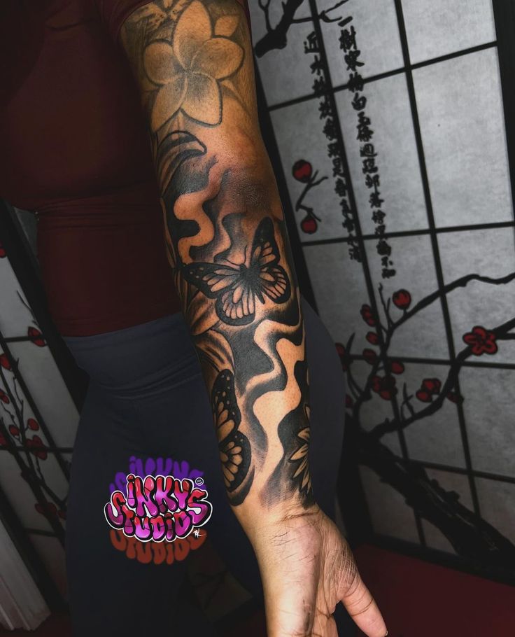 a person with a tattoo on their arm