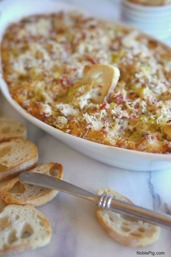 a casserole dish with bread on the side