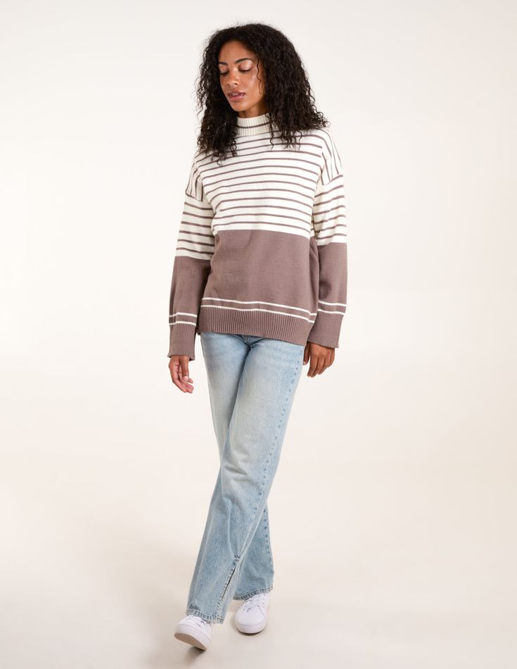 A fun option for those colder days ahead! This stripe jumper, is a cute fun option for you! Team with jeans and chunky boots, and PU jacket for the perfect Autumnal look! 44% Acrylic, 33% Polyester, 23% Polyamide Made In China Machine washableLong sleeve High neck Unfastened This item is a ONE size that fits UK 8-16 Model height: 5ft 11 / 180cm Trendy Striped Outerwear For Layering, Cotton Sweater With Striped Hem For Winter, Casual Spring Sweater With Striped Hem, Trendy Contrast Stripe Sweater For Fall, Cotton Sweater With Striped Hem For Fall, Fall Outerwear With Contrast Stripes, Casual Fall Outerwear With Contrast Stripes, White Striped Hem Sweater For Fall, Trendy Fall Outerwear With Contrast Stripes