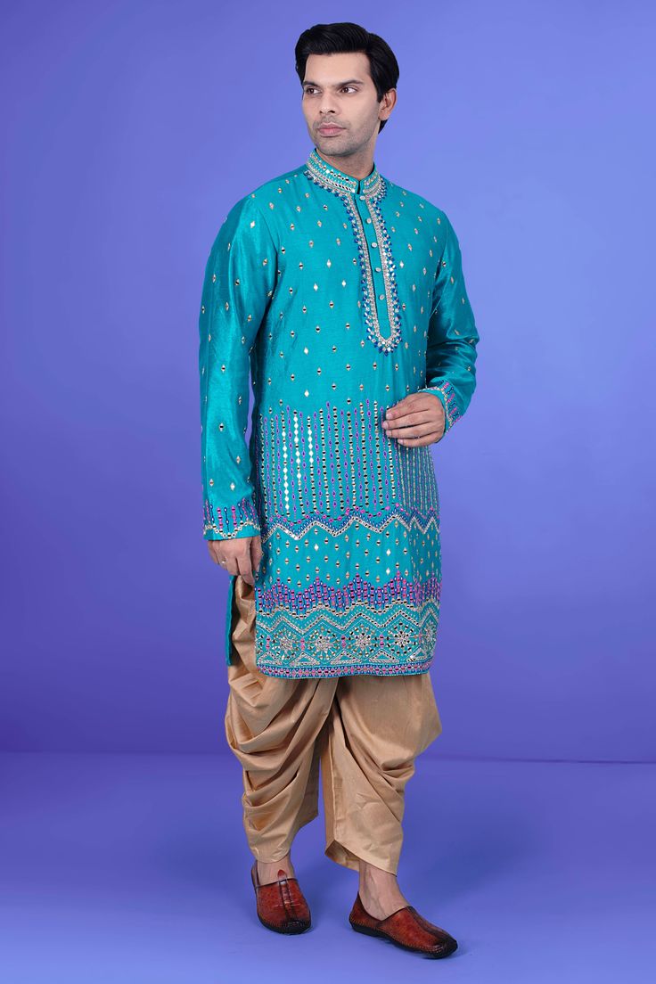 Enhance your style with our Mens Kurta salwar J171-N217. This premium piece features intricate mirror and thread work, elevating the look to a whole new level. Perfect for special occasions or elevating your everyday style. Experience luxury and elegance in every wear. Blue Sherwani With Gota Work, Designer Blue Sherwani With Gota Work, Blue Bollywood Bandhgala With Mirror Work, Blue Sherwani With Mirror Work For Festivals, Blue Sherwani With Mirror Work For Eid, Blue Sherwani With Mirror Work In Traditional Drape, Blue Sherwani With Mirror Work, Blue Bollywood Sherwani With Gota Work, Blue Sherwani With Gota Work For Festivals