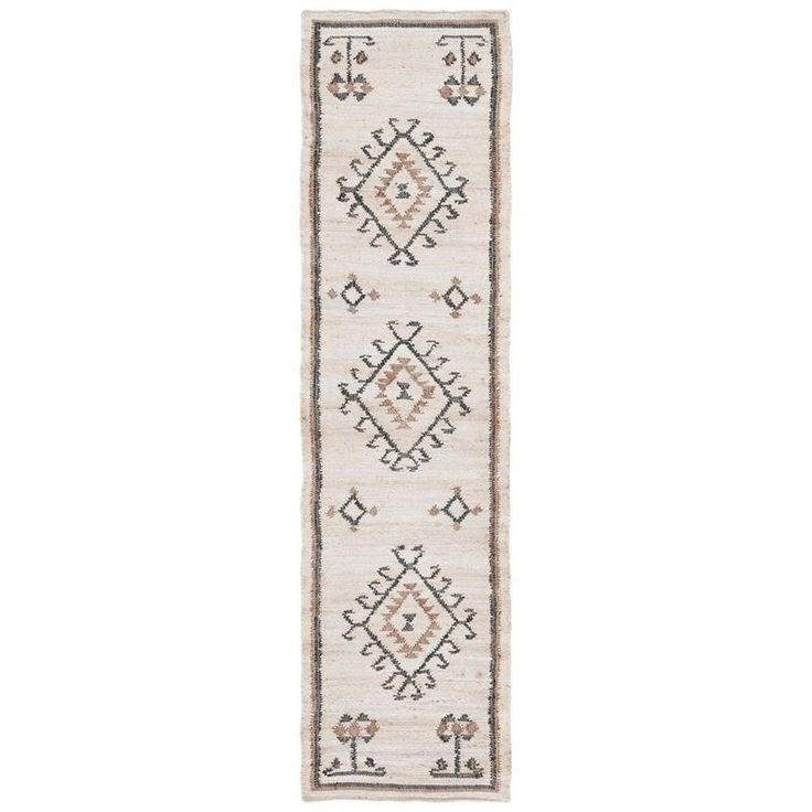 a white runner rug with an intricate design on the bottom and sides, in two different colors