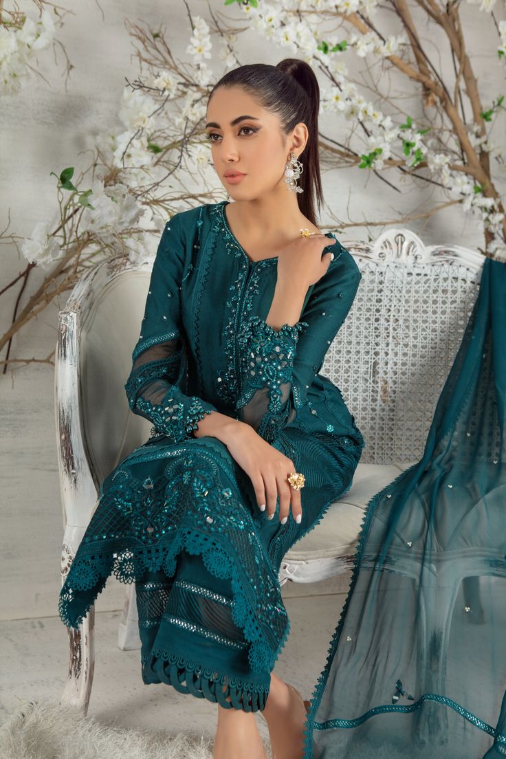 Stylish and trendy this mono tone silk net ensemble is a must have this Eid season, adorned with silk thread embroidery enhance with sequins, beads, pearls and stunning glitzy mirror details to accentuate the entire look, lace composed panels and bead tassel completes this look, paired with lace detailed culottes, mirror, pearl and lace embellished chiffon dupatta to uplift your day or night look. Shirt Fabric: Pure Silk Net Shirt Length: 45” cullotes Fabric: Khaadi Silk Dupatta Fabric: Pure Chi Bollywood Style Sequined Palazzo Set For Eid, Elegant Semi-stitched Lace Lehenga, Eid Reception Traditional Wear With Sequins, Sequined Anarkali Set For Reception And Eid, Party Wear Semi-stitched Sharara With Sequins, Glamorous Eid Dresses With Zari Work, Diwali Sequin Georgette Palazzo Set, Glamorous Festive Dresses With Dabka Work, Semi-stitched Bollywood Lace Salwar Kameez