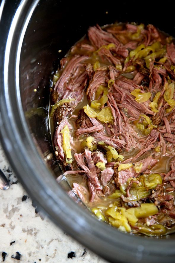 the food is being cooked in the slow cooker