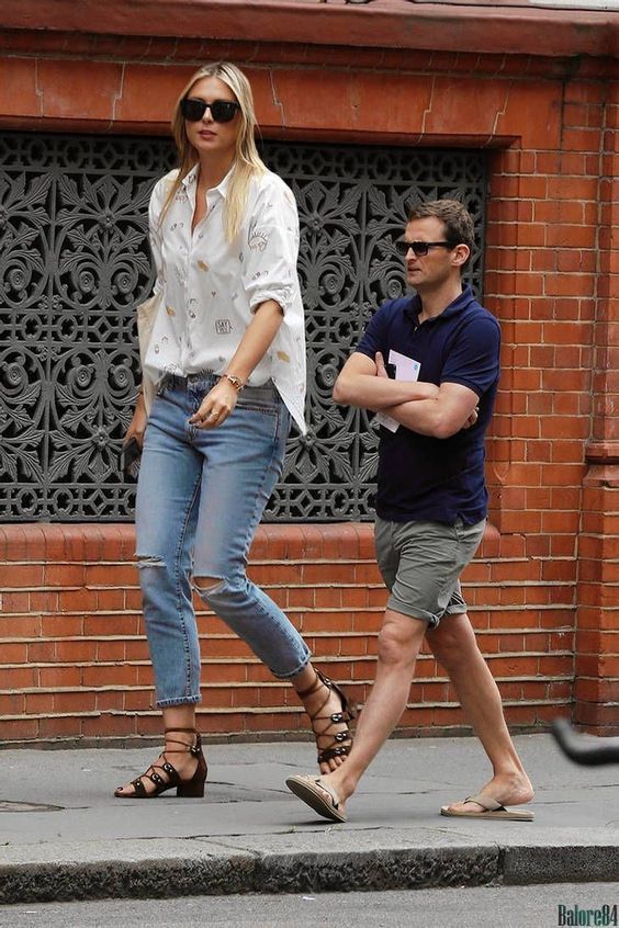 a man and woman walking down the street