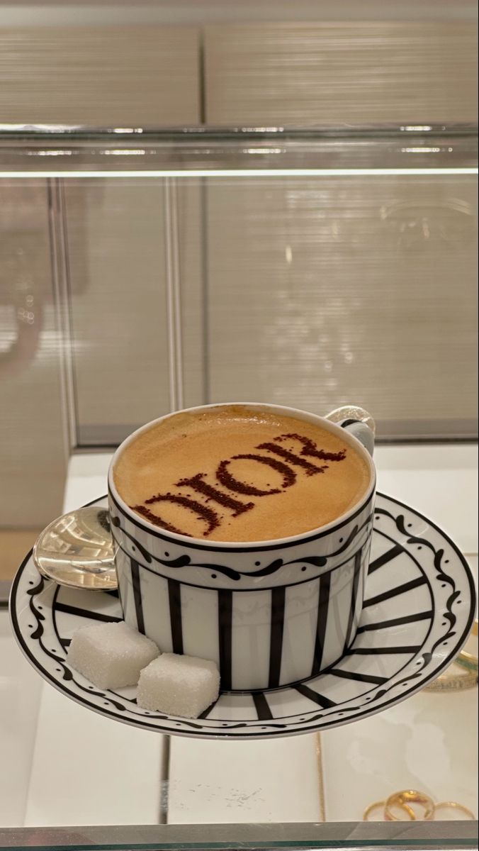 a coffee cup with the word mom written on it