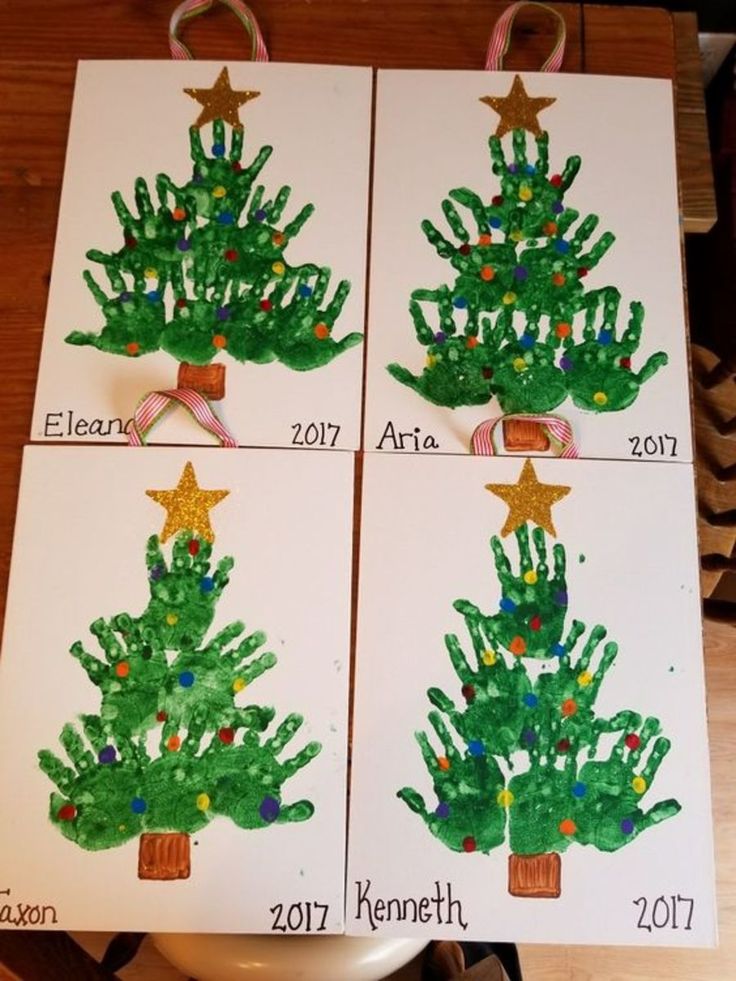 four handprinted christmas cards with different trees on them