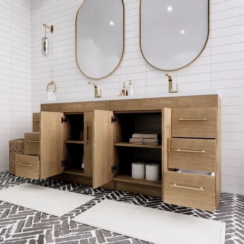 a bathroom with two mirrors above the sink and drawers on the wall next to each other