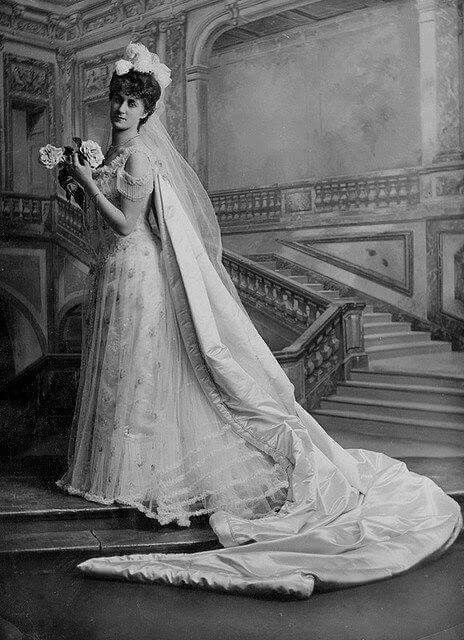 an old photo of a woman in a wedding dress