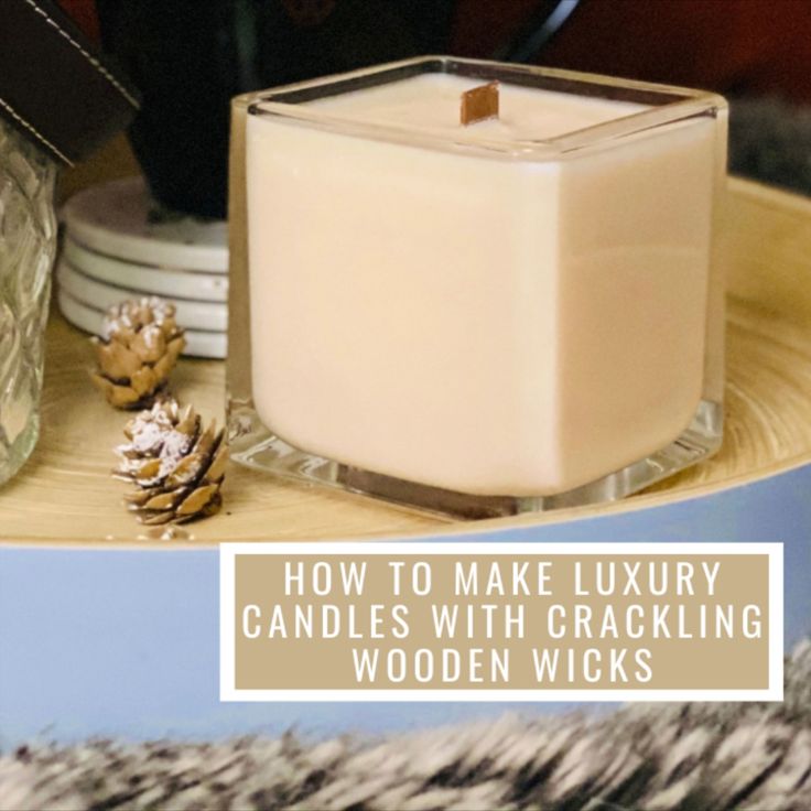 a candle sitting on top of a wooden table next to pine cones and other items