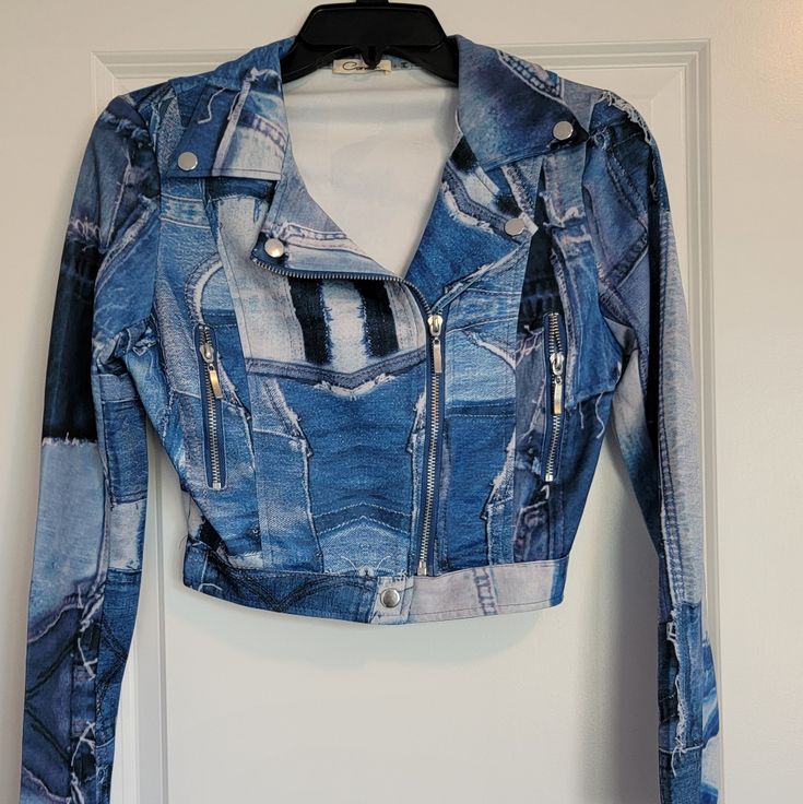 Fashion Nova Denim Patchwork Print Jacket - New Without Tags. Never Worn. Fitted Denim Biker Jacket With Long Sleeves, Fitted Long Sleeve Denim Biker Jacket, Fitted Blue Cropped Cotton Jacket, Fall Denim Long Sleeve Biker Jacket, Winter Cropped Blue Denim Jacket, Fall Denim Biker Jacket With Long Sleeves, Denim Long Sleeve Biker Jacket For Fall, Fitted Blue Cotton Cropped Jacket, Casual Cropped Fitted Biker Jacket