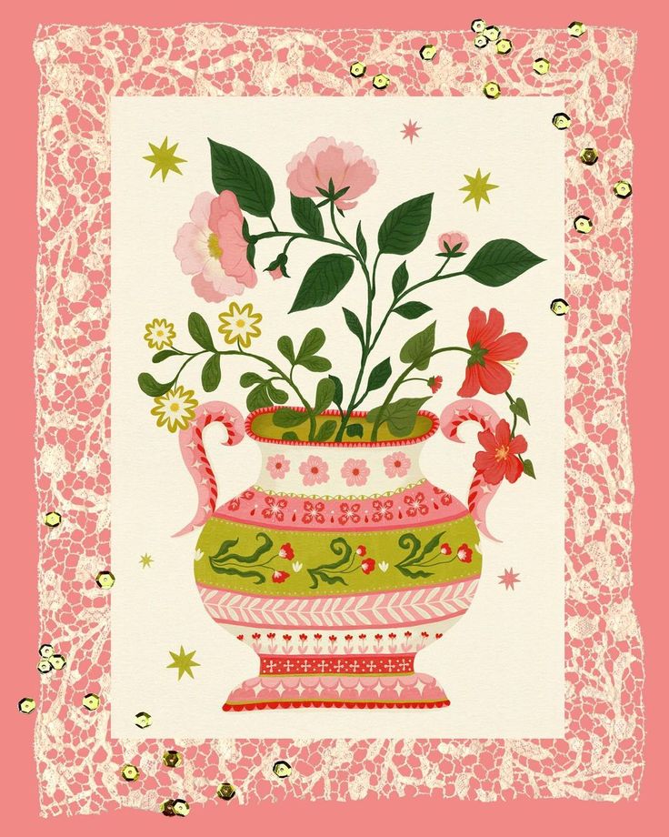 a pink and green vase with flowers in it