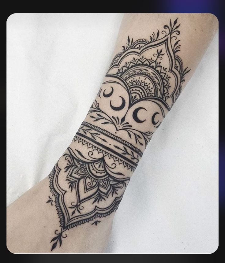 a woman's arm with an intricate design on it