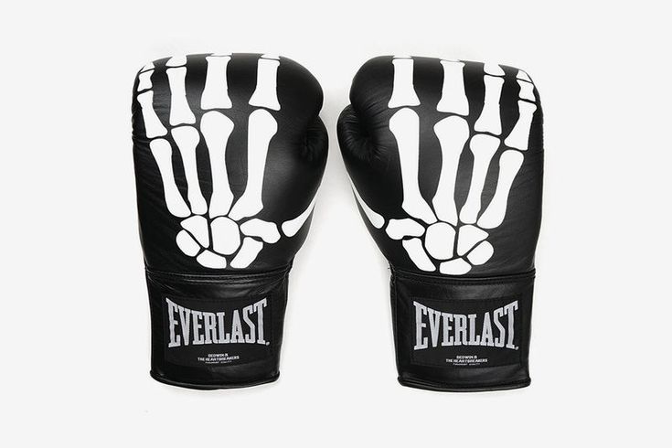 the everlast boxing gloves are black and white with skeleton prints on it,